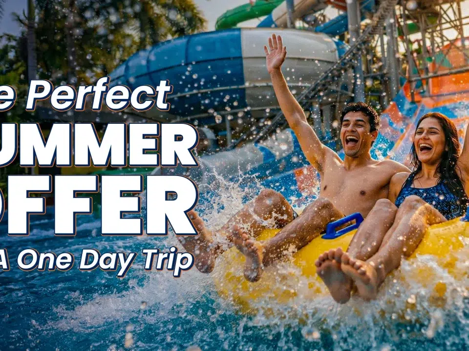 A young man and woman cheering with arms raised on a yellow raft at Wet’nJoy, the top choice for a one day trip to Lonavala featuring the best water park offers for summer 2026.
