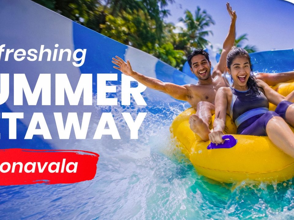 A happy couple laughing and splashing down a blue water slide on a yellow tube raft, highlighting fun summer activities and things to do in summer in Lonavala.