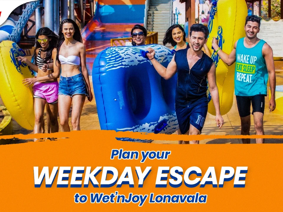 A group of cheerful friends splashing water and cheering in a massive wave pool, highlighting budget-friendly things to do near Mumbai on weekdays using special Tuesday deals and Thursday offers at Wet’nJoy Lonavala.