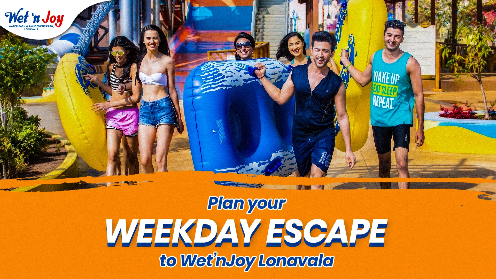 A group of cheerful friends splashing water and cheering in a massive wave pool, highlighting budget-friendly things to do near Mumbai on weekdays using special Tuesday deals and Thursday offers at Wet’nJoy Lonavala.