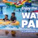 Friends enjoying at Wet'nJoy, the best water park in Lonavala during the monsoon with colorful water slides and pools.